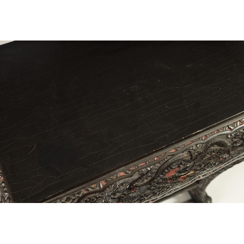 121 - A LATE 19TH CENTURY CHINESE RED GROUND AND BLACK LACQUERWORK CENTRE TABLE the plain top on a rounded... 