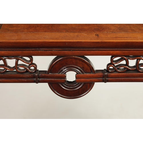 125 - A 19TH CENTURY CHINESE HARDWOOD ALTAR TABLE with panelled top and scrolled carved sides joined by a ... 