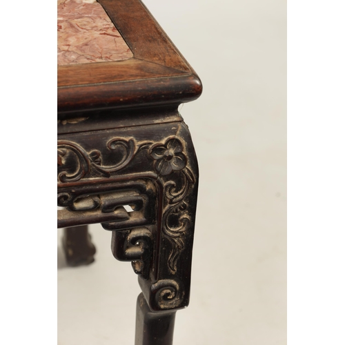 129 - A 19TH CENTURY CHINESE HARDWOOD JARDINIERE STAND with inset marble top above a carved pierced base w... 