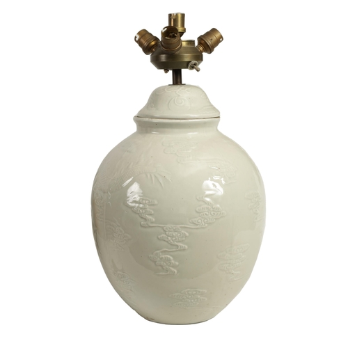 136 - A 20TH CENTURY CHINESE CELADON PORCELAIN BULBOUS JAR AND COVER CONVERTED INTO A TABLE LAMP decorated... 