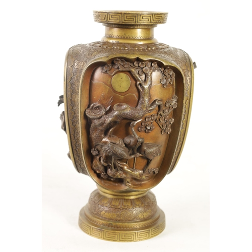 137 - A JAPANESE MEIJI PERIOD BRONZE AND GILT BRONZE RELIEF MOULDED VASE with four high relief panels depi... 