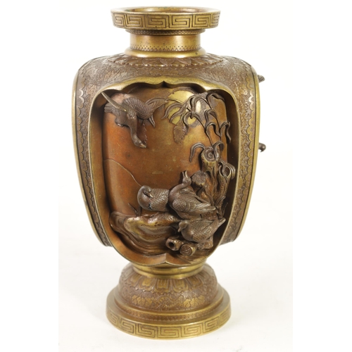 137 - A JAPANESE MEIJI PERIOD BRONZE AND GILT BRONZE RELIEF MOULDED VASE with four high relief panels depi... 