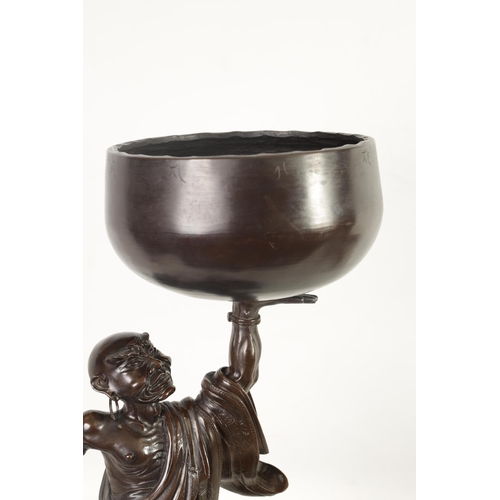 138 - A LARGE 19TH CENTURY CHINESE BRONZE RAKAN FIGURAL TABLE GONG depicted holding a large bowl gong; rai... 