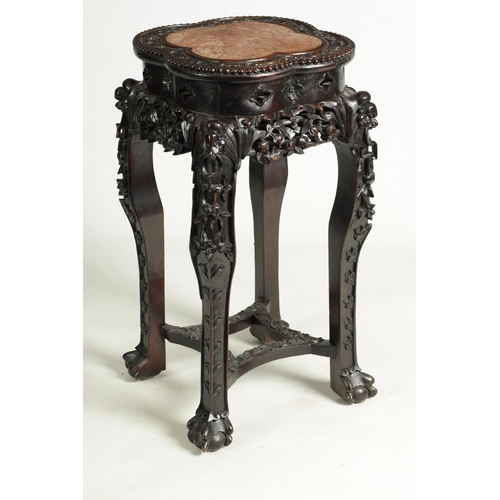 139 - A 19TH CENTURY CHINESE PROFUSELY CARVED HARDWOOD JARDINIERE STAND the lobed flowerhead and leaf-carv... 