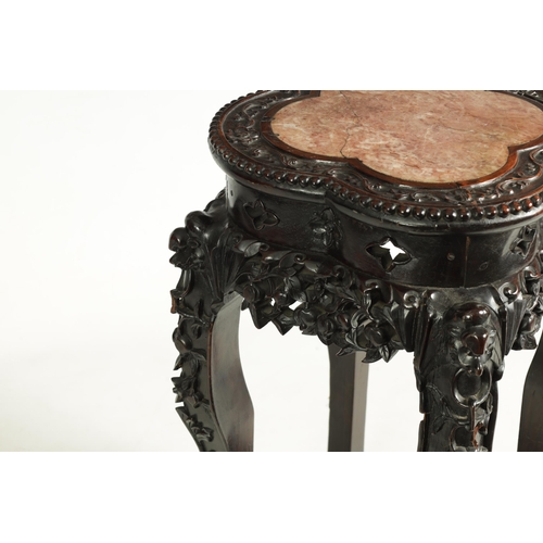 139 - A 19TH CENTURY CHINESE PROFUSELY CARVED HARDWOOD JARDINIERE STAND the lobed flowerhead and leaf-carv... 