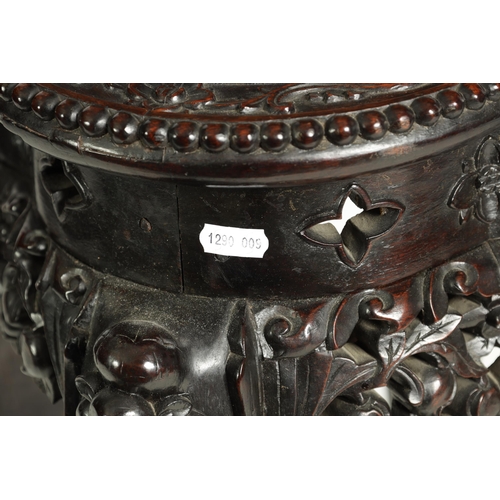 139 - A 19TH CENTURY CHINESE PROFUSELY CARVED HARDWOOD JARDINIERE STAND the lobed flowerhead and leaf-carv... 