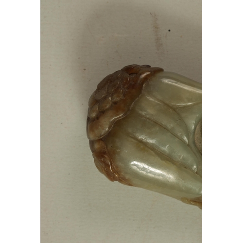 144 - A CHINESE CARVED JADE SCULPTURE modelled as a seated Buddha with russet inclusions to the top (10cm ... 