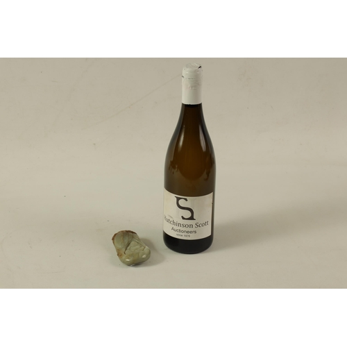 144 - A CHINESE CARVED JADE SCULPTURE modelled as a seated Buddha with russet inclusions to the top (10cm ... 