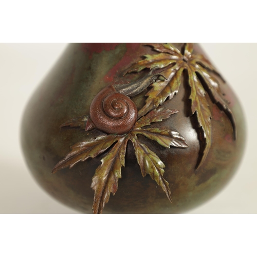 146 - A JAPANESE MEIJI PERIOD MULTI PATINA BRONZE SNAIL VASE the slender neck and applied leaf work decora... 