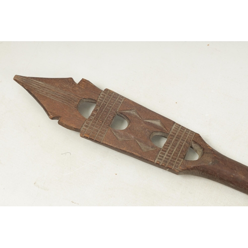 150 - A 19TH CENTURY AFRICAN HARDWOOD PADDLE with cross-hatched carved decoration (167cm overall)