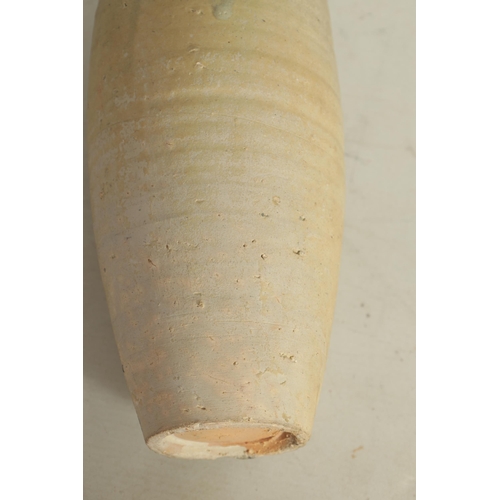 153 - A CHINESE SONG CREAM GLAZED TALL VASE with grooved ovoid body and flared rim (29cm high)