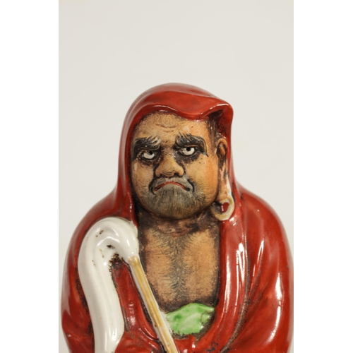 155 - TWO MEIJI PERIOD JAPANESE KUTANI PORCELAIN FIGURES OF DARUMA both dressed in red robes and holding f... 