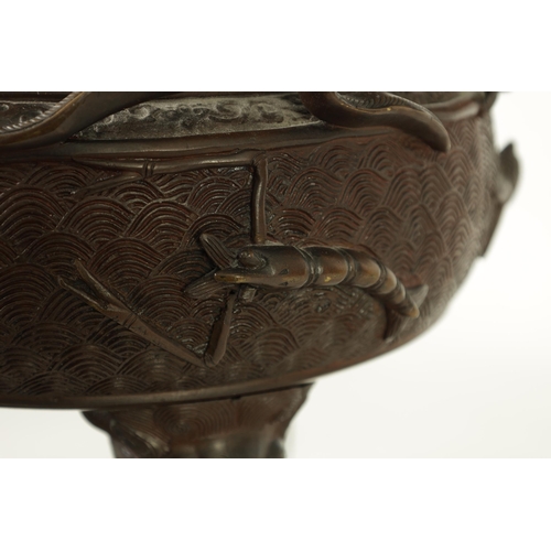 156 - A 19TH CENTURY CHINESE BRONZE CENSER AND LID MOUNTED ON A HARDWOOD STAND with pierced dragons head a... 