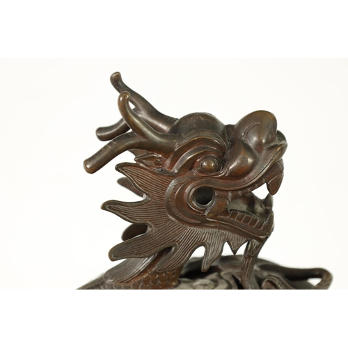 156 - A 19TH CENTURY CHINESE BRONZE CENSER AND LID MOUNTED ON A HARDWOOD STAND with pierced dragons head a... 