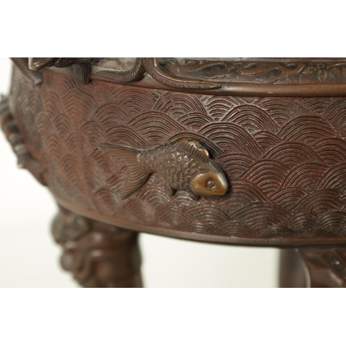 156 - A 19TH CENTURY CHINESE BRONZE CENSER AND LID MOUNTED ON A HARDWOOD STAND with pierced dragons head a... 