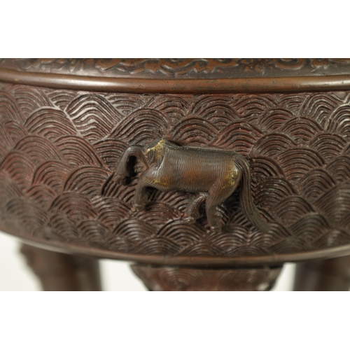 156 - A 19TH CENTURY CHINESE BRONZE CENSER AND LID MOUNTED ON A HARDWOOD STAND with pierced dragons head a... 