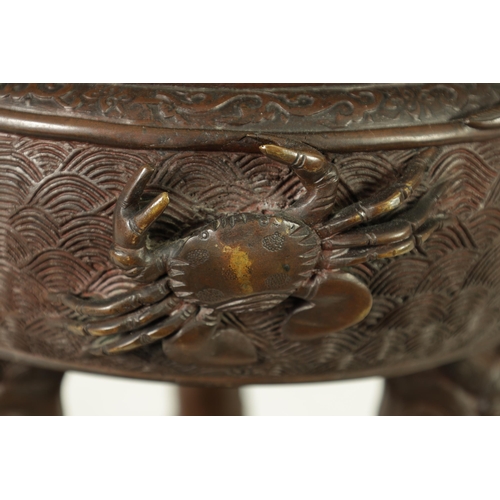 156 - A 19TH CENTURY CHINESE BRONZE CENSER AND LID MOUNTED ON A HARDWOOD STAND with pierced dragons head a... 