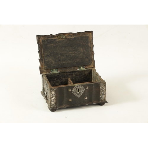 159 - AN 18TH CENTURY CEYLONESE CARVED EBONY AND SILVER METAL MOUNTED JEWELLERY BOX with leaf carved serpe... 