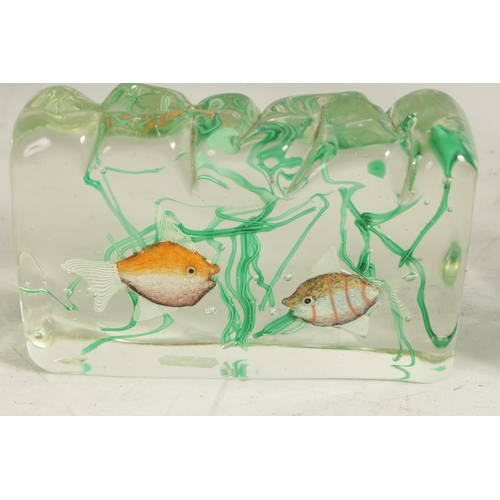 16 - THREE MURANO MOULDED GLASS AQUARIUMS with brightly coloured exotic fish amongst coral, (18cm, 10cm a... 