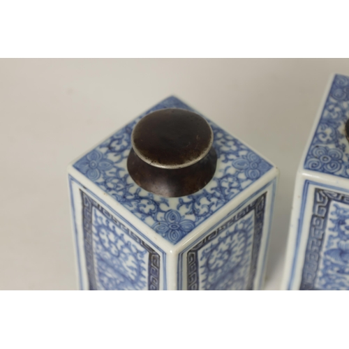 160 - A PAIR OF 19TH CENTURY CHINESE BLUE AND WHITE SQUARE TEA CADDIES WITH METAL COVERS with all-round fo... 