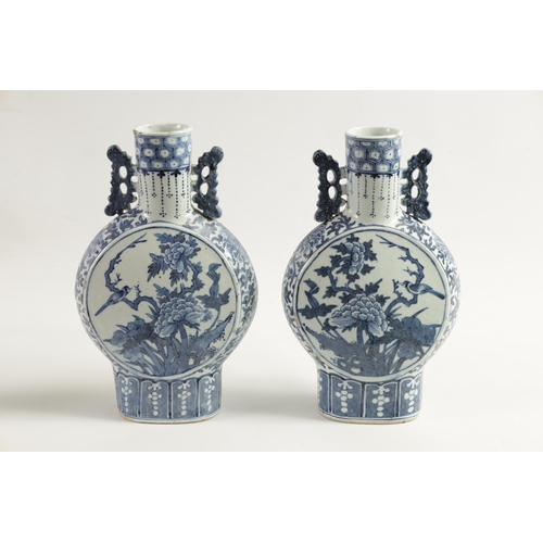 161 - A PAIR OF 19TH CENTURY CHINESE BLUE AND WHITE MOON FLASKS decorated with birds amongst flowering bra... 