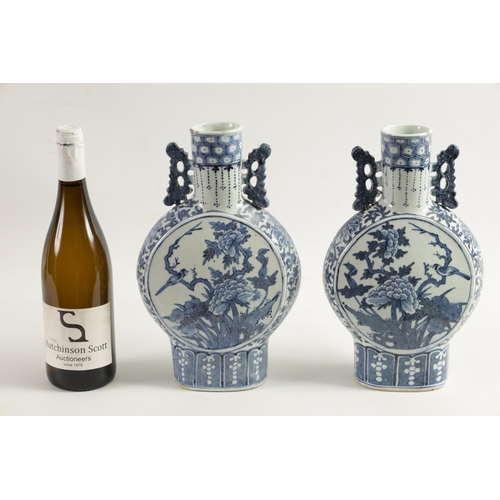 161 - A PAIR OF 19TH CENTURY CHINESE BLUE AND WHITE MOON FLASKS decorated with birds amongst flowering bra... 