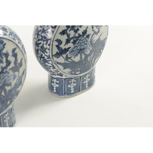 161 - A PAIR OF 19TH CENTURY CHINESE BLUE AND WHITE MOON FLASKS decorated with birds amongst flowering bra... 