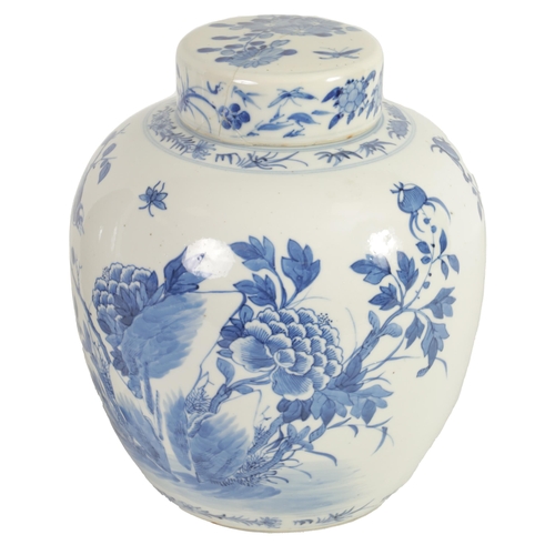 162 - AN 18TH CENTURY CHINESE BLUE AND WHITE GINGER JAR AND COVER decorated with flowering branchwork - si... 