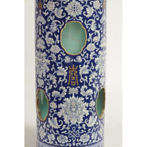 166 - A 19TH CENTURY CHINESE PORCELAIN BLUE AND WHITE CYLINDRICAL VASE decorated with lotus leaves amongst... 