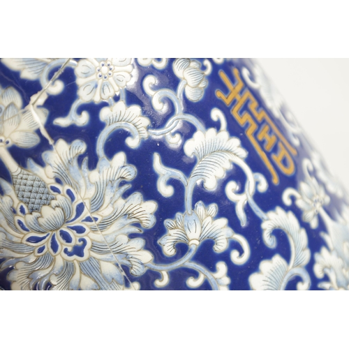 166 - A 19TH CENTURY CHINESE PORCELAIN BLUE AND WHITE CYLINDRICAL VASE decorated with lotus leaves amongst... 