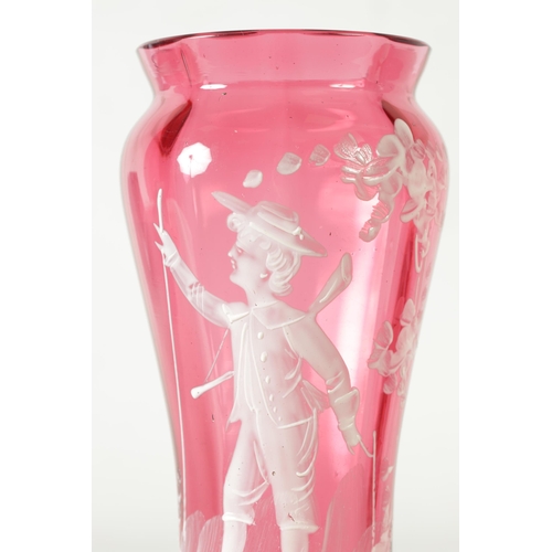 17 - TWO 19TH CENTURY MARY GREGORY STYLE CRANBERRY GLASS OVERLAY VASES both depicting a boy in garden set... 