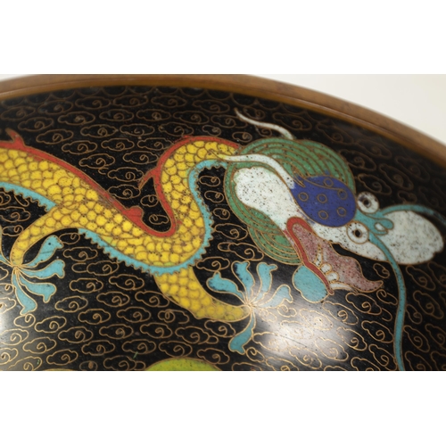 171 - A CHINESE CLOISONNE ENAMEL DRAGON BOWL decorated with five claw dragons amongst copper inlaid clouds... 