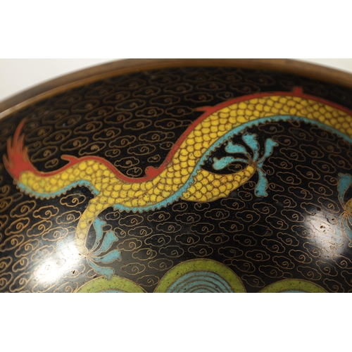 171 - A CHINESE CLOISONNE ENAMEL DRAGON BOWL decorated with five claw dragons amongst copper inlaid clouds... 
