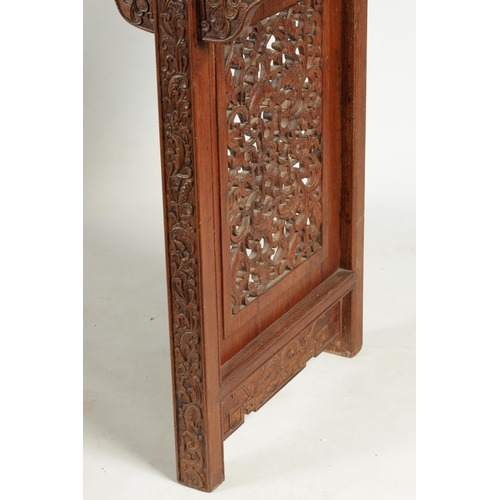 172 - A 19TH CENTURY CHINESE HARDWOOD ALTAR TABLE the top with raised sides above a shaped leaf carved fri... 