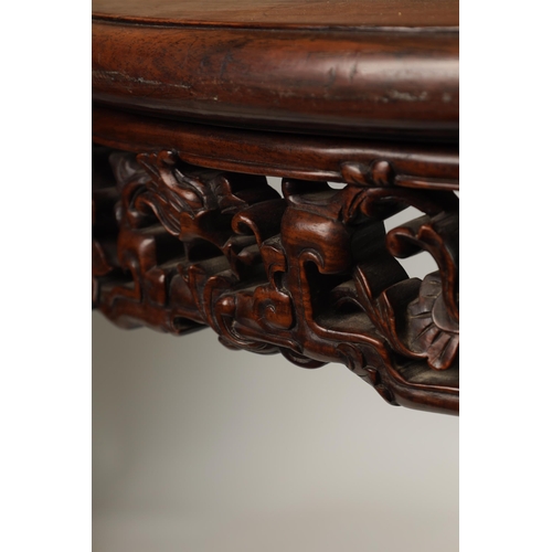 180 - A GOOD 19TH CENTURY CHINESE HARDWOOD CENTRE TABLE with inset marble top above a carved pierced work ... 