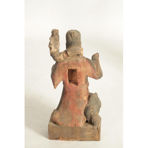 185 - A CHINESE MING PERIOD CARVED WOODEN FIGURE OF AN IMMORTAL with polychrome and gilt decoration. (24cm... 