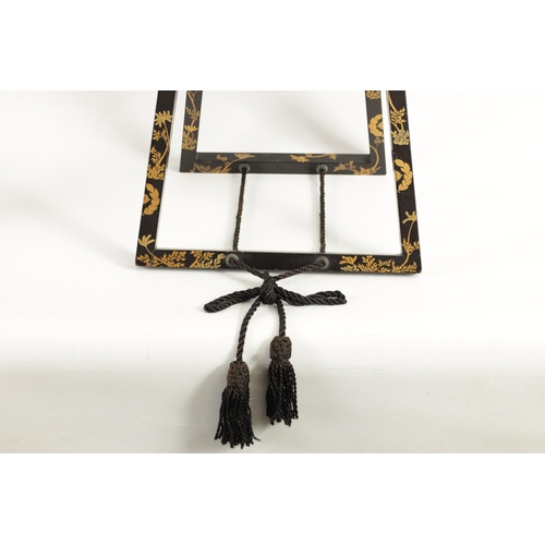 187 - A LATE EDO PERIOD JAPANESE LACQUERED FOLDING MIRROR STAND of easel form with scrolled top and decora... 