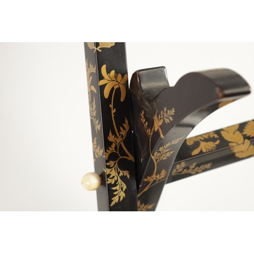 187 - A LATE EDO PERIOD JAPANESE LACQUERED FOLDING MIRROR STAND of easel form with scrolled top and decora... 