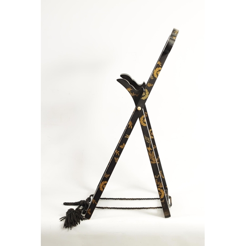 187 - A LATE EDO PERIOD JAPANESE LACQUERED FOLDING MIRROR STAND of easel form with scrolled top and decora... 