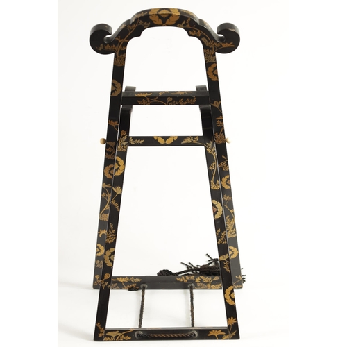 187 - A LATE EDO PERIOD JAPANESE LACQUERED FOLDING MIRROR STAND of easel form with scrolled top and decora... 