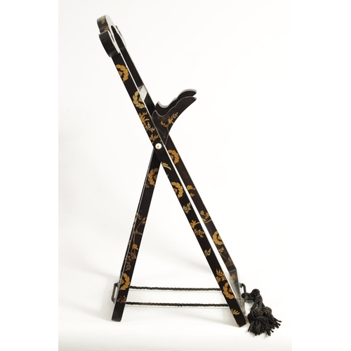 187 - A LATE EDO PERIOD JAPANESE LACQUERED FOLDING MIRROR STAND of easel form with scrolled top and decora... 