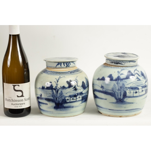 191 - TWO LATE MING CHINESE BLUE AND WHITE STONEWARE GINGER JARS AND COVERS decorated with men fishing in ... 