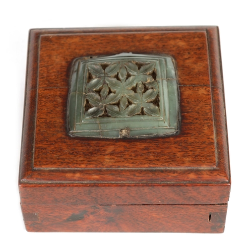 192 - AN EARLY CHINESE JADE PLAQUE MOUNTED ON LATER BOX of square form finely pierced and carved in a leaf... 