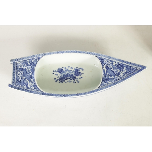 201 - A 19TH CENTURY CHINESE BLUE AND WHITE PORCELAIN BOAT-SHAPED DISH the top decorated with carp amongst... 