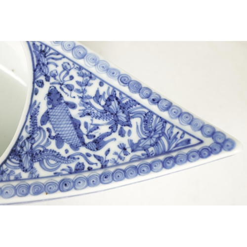 201 - A 19TH CENTURY CHINESE BLUE AND WHITE PORCELAIN BOAT-SHAPED DISH the top decorated with carp amongst... 