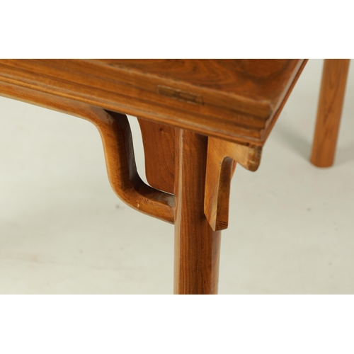 203 - A 20TH CENTURY CHINESE ELM CENTRE TABLE the cleated panelled figured top above a shaped all round cu... 