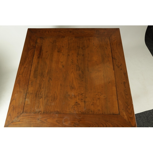 203 - A 20TH CENTURY CHINESE ELM CENTRE TABLE the cleated panelled figured top above a shaped all round cu... 