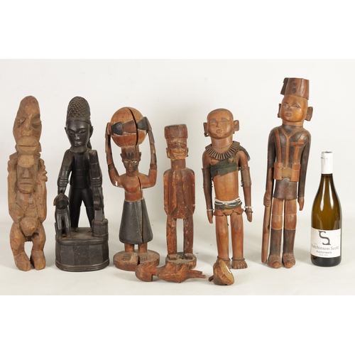 204 - A SELECTION OF SEVEN CARVED AFRICAN FIGURES of various size and design (50cm high and smaller )