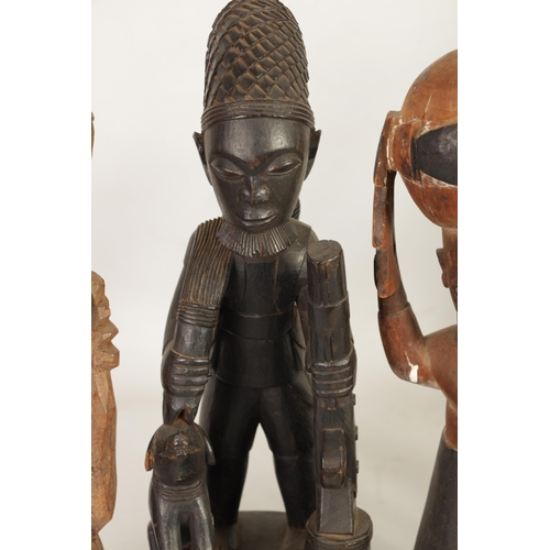 204 - A SELECTION OF SEVEN CARVED AFRICAN FIGURES of various size and design (50cm high and smaller )