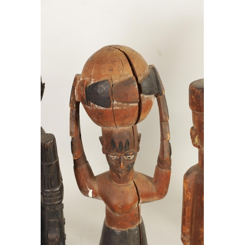 204 - A SELECTION OF SEVEN CARVED AFRICAN FIGURES of various size and design (50cm high and smaller )